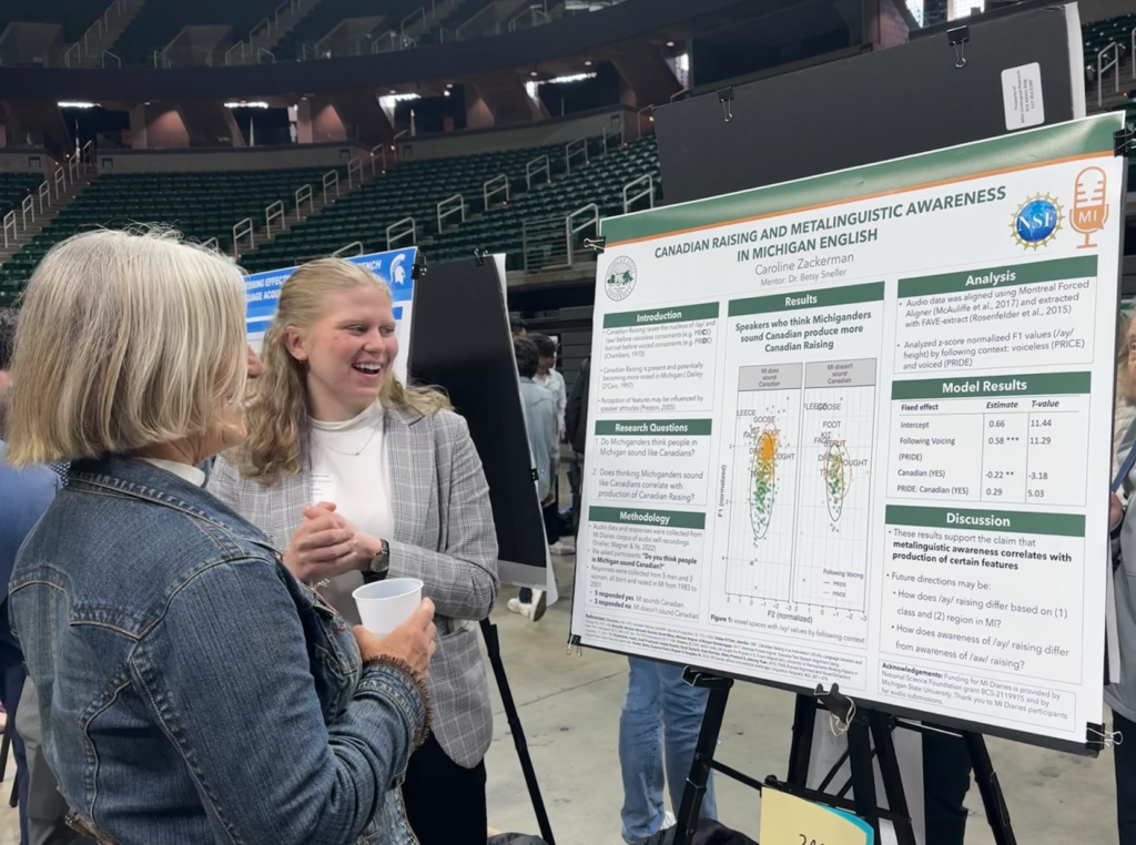 Caroline Zackerman talks to a UURAF 2024 visitor about her poster.